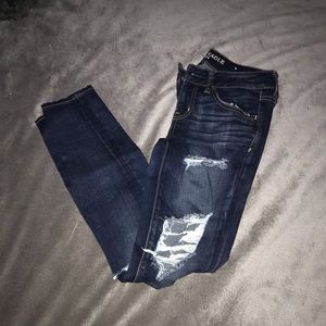 Dark ripped American Eagle super stretch x jeans.